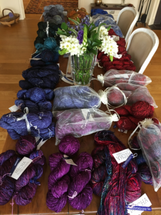 Dinner table full of colorful yarn